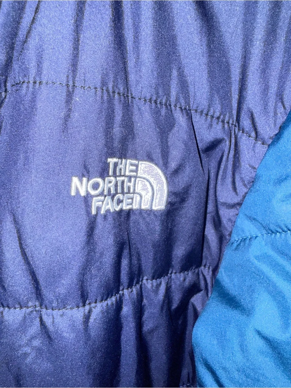 The North Face reversible puffer jacket with a soft, fleece lining, size 14/16